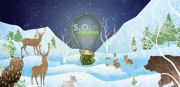 snowy mountaintop with animals surrounding light bulb showcasing brand logo